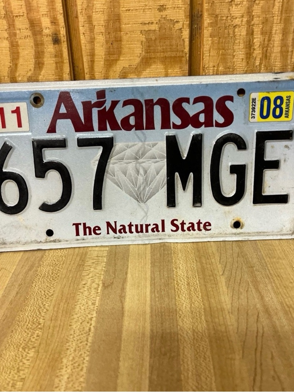 Arkansas License Plate "657 MGE" - White with Burgundy Text